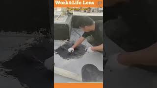 Worker applies bitumen sheets to flat roof holes fusing with heat for waterproofing [upl. by Bibbye208]