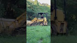 Clearing the field with my boy John Deere 450c [upl. by Inah]