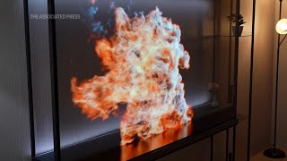 At CES LG unveils ‘world’s first’ wireless transparent OLED TV [upl. by Nnyllatsyrc995]