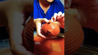 Craftsman polishes the purple clay teapot with sandpaper [upl. by Ymmik]