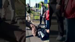 Ecoprotesters fall to floor wrestling in the road with angry motorists [upl. by Gordy314]