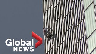 Daredevil free climber scales one of Europes highest skyscrapers [upl. by Aihsercal942]