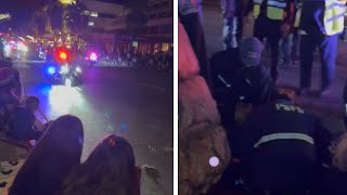 Motorcycle Cop Crashes Into Spectators at Holiday Parade [upl. by Idnahc692]