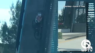 Video shows bicyclist cling to North Palm Beach bridge as it rises [upl. by Darrow863]