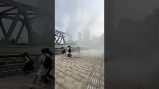 Tide of Qiantang River showers spectators on bridge [upl. by Uzia]