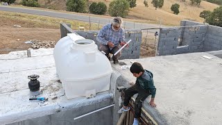 Putting water tank on the roof and installing water heater for bathroom and kitchen [upl. by Namra]