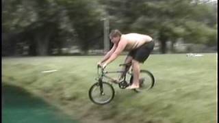 Fat kid rides his bike into a pond [upl. by Bradan]