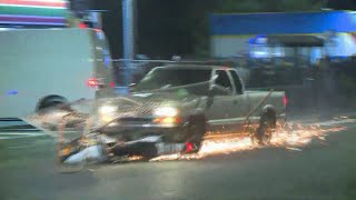 Pickup plows through protester crowd drags motorcycle [upl. by Ecyarg]