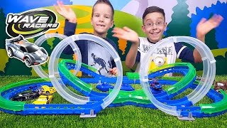 Игровой набор серии WAVE RACERS – Двойные виражи трек 3 петли 1 сенсорн машинка заряд устр во [upl. by Apoor]