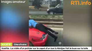 Insolite  Un agent de police trimballé sur capot dun taxi de Plateau à Treichville Abidjan [upl. by Htaek]