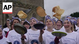 In this centuriesold English pancake race you just have to go flat out [upl. by Attenat]