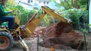 Ingersoll 6018 loader backhoe digging a hole [upl. by Caton273]