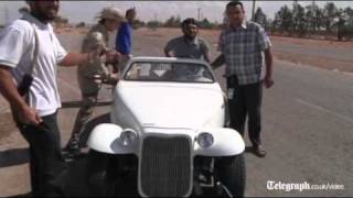 Libyan fighters loot Muammar Gaddafis luxury cars [upl. by Prosper291]