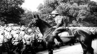 German troops decorated and troops pass in review along Avenue Foch Paris durinHD Stock Footage [upl. by Aspia]