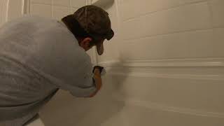 Caulking a bathtub surround [upl. by Thesda]