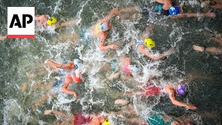 Triathlon kicks off on Day 5 at Paris Olympics  AP Top Photos [upl. by Liebman]