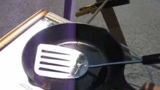 Fresnel lens and mirror solar cooker cast iron pan [upl. by Eyoj447]