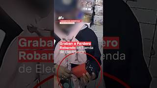 Cámaras de seguridad graban a fardero robando en tienda de electrónica  N Shorts [upl. by Oinesra]