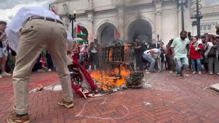 Man Tries to Save Burning American Flag at Protest [upl. by Niuqaoj]