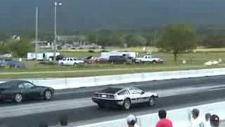 Electric DeLorean Drag Racing an Electric Porsche [upl. by Elleinod]