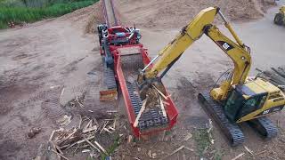 Morbark 6400XT Horizontal Grinder Processing Pallets Stumps and Yard Waste [upl. by Halueb]