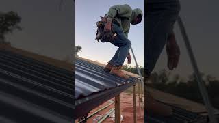 Watch us install the roof on this pole barn one metal sheet at a time PoleBarn Barndominium [upl. by Nicko]