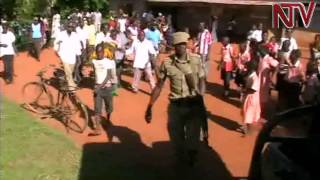 Police saves Kamuli man who tortured child from irate lynch mob [upl. by Dauf297]