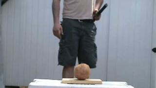 Cutting a coconut in half with katana [upl. by Yehsa]