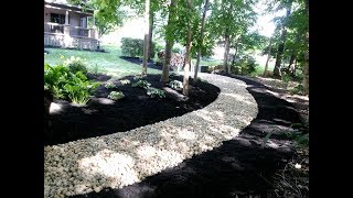 Installing river rock to solve some landscape problems [upl. by Nerrad518]