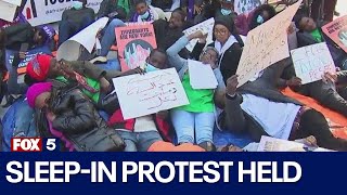 NYC migrant advocates hold sleepin protest against decision limiting shelter stays for asylum see [upl. by Beare]