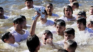 Epiphany celebration 57 dove into the water to retrieve the cross [upl. by Alliber139]