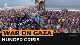 Hungry Palestinians crowd aid truck in Gaza  Al Jazeera Newsfeed [upl. by Garvy]