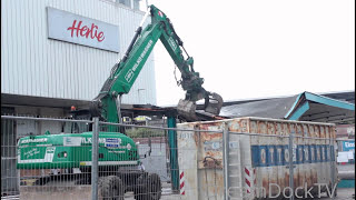 lovely painted Caterpillar M322D excavator demolishing old bus stop [upl. by Atinnod]