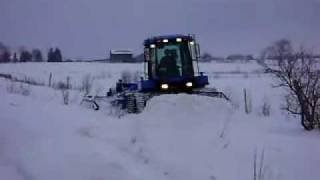 Snowmobile Trail Grooming New Holland TV 140 Four Track With the new VARIBLE WIDTH SNOW DRAG [upl. by Milak]