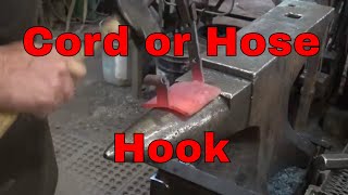 Forged hook for hanging cords or hoses  blacksmithing project [upl. by Gearhart636]