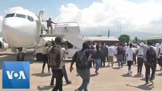 Deported Haitians Try to Rush Back Onto Plane [upl. by Cianca]