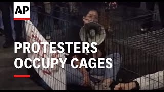 Protesters block Tel Aviv road and occupy cages as they demand return of hostages still held in Gaza [upl. by Nnylireg723]