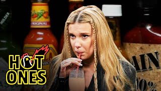 Millie Bobby Brown Needs a Milkshake While Eating Spicy Wings  Hot Ones [upl. by Seldun230]