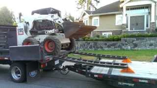 Crazy landscapers unload bobcat [upl. by Garvin180]