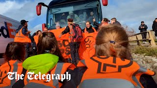 Driver ploughs through Just Stop Oil protesters blocking migrant coach heading to Bibby Stockholm [upl. by Elimay]