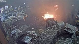 Foundry worker puts wet scrap metal in furnace [upl. by Mylor]