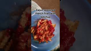 Cajun seasoned french fries with ketchup and cheese [upl. by Nierman238]