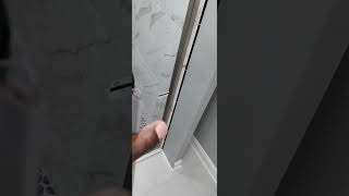 installation of a Kohler pivot shower door [upl. by Auqeenahs]