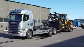 Scania R420 Hook lifter unloading a new JCB426E Weelloader [upl. by Enimsay]