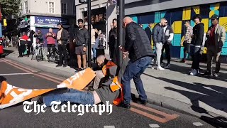 I have to go to hospital Motorists drag Just Stop Oil protesters off the road in London [upl. by Eixor721]