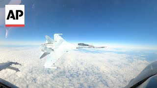 Video shows Russian jet flying within feet of US F16 near Alaska [upl. by Sacrod]