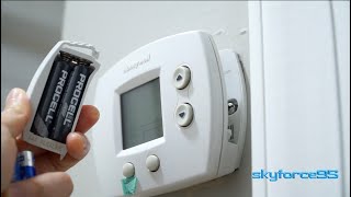 How to Replace the Batteries in a Honeywell Thermostat [upl. by Ahsenit]