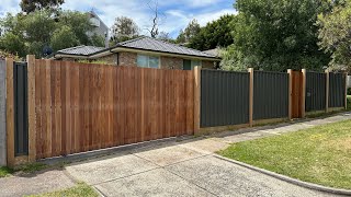 Colorbond fence with exposed posts and vertical merbau cladded gates [upl. by Arakawa]