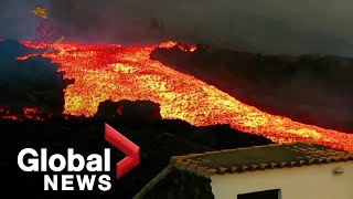 La Palma volcano Lava quottsunamiquot gushes down hillside after overflowing main cone [upl. by Saisoj]