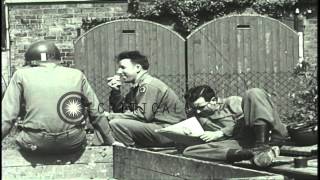 Soldiers of 71st Infantry Regiment relax in boxcars read play cards and musicalHD Stock Footage [upl. by Ayotac]